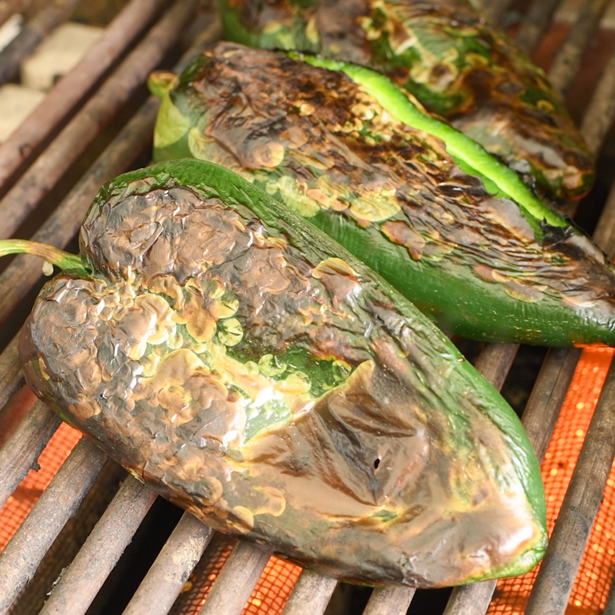 Roast poblano peppers until charred.