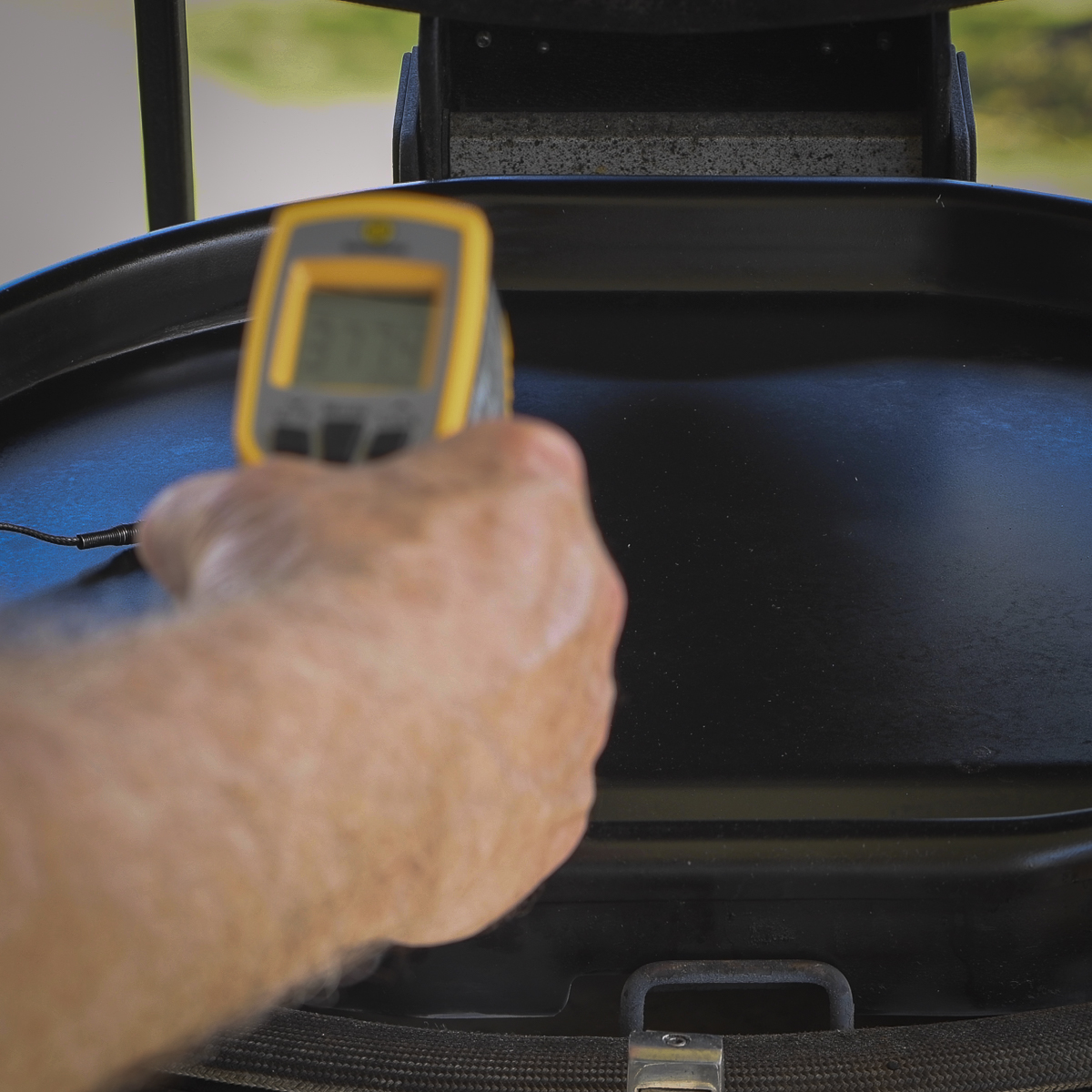 An IR thermometer tells you the surface temperature of the griddle.