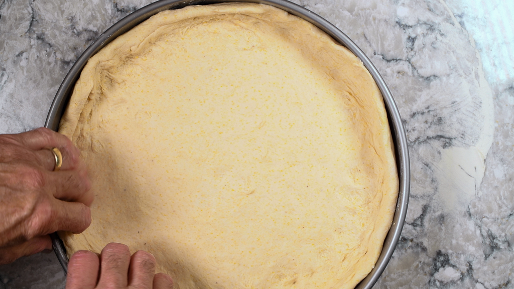 Placing Deep Dish Pizza Dough in Pan