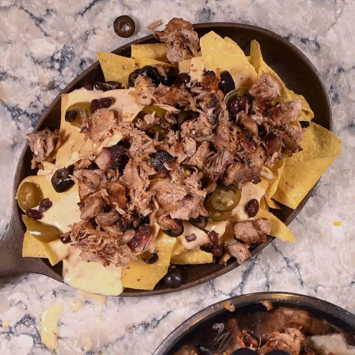 Add carnitas and black beans.