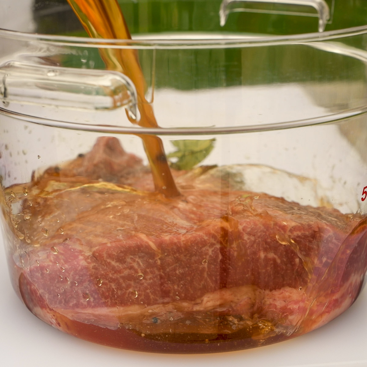 Add the brine solution to the brisket.