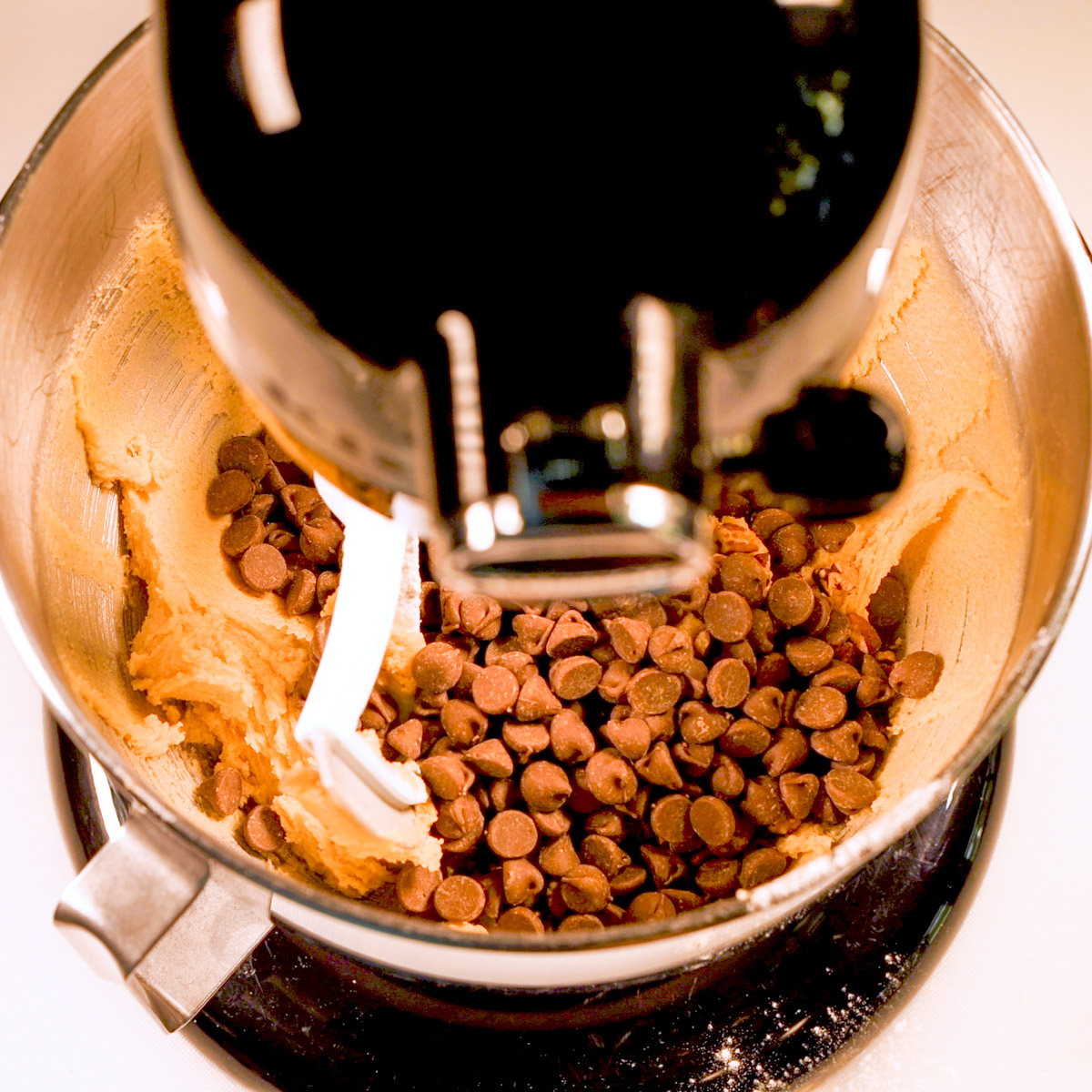 Add chocolate chips to the butter and brown sugar mixture.