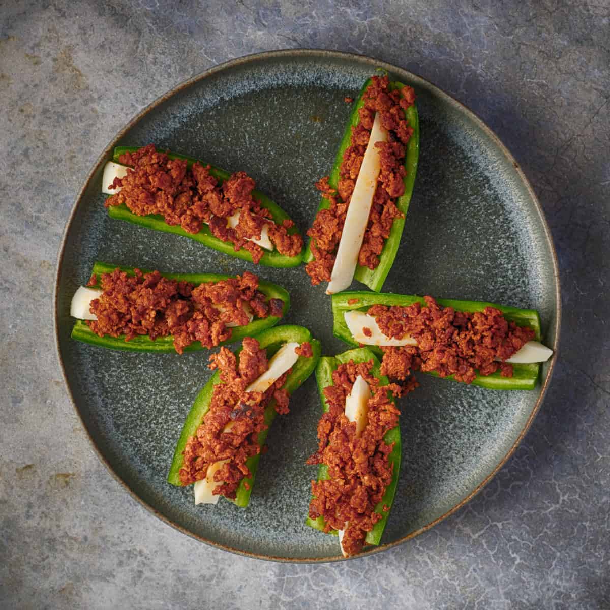 Add chorizo to the jalapeno.