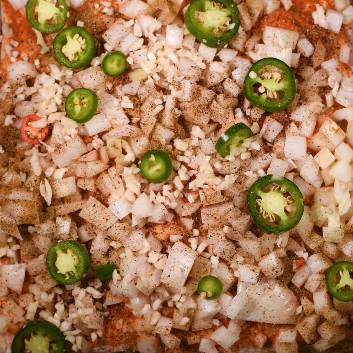 Add peppers on top of the pork belly.