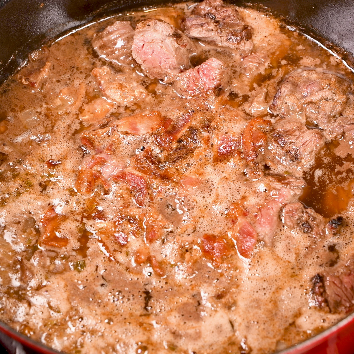 Add the water, beer and coffee to the Dutch oven.