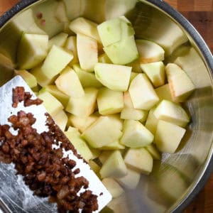 Add guanciale to the apples.