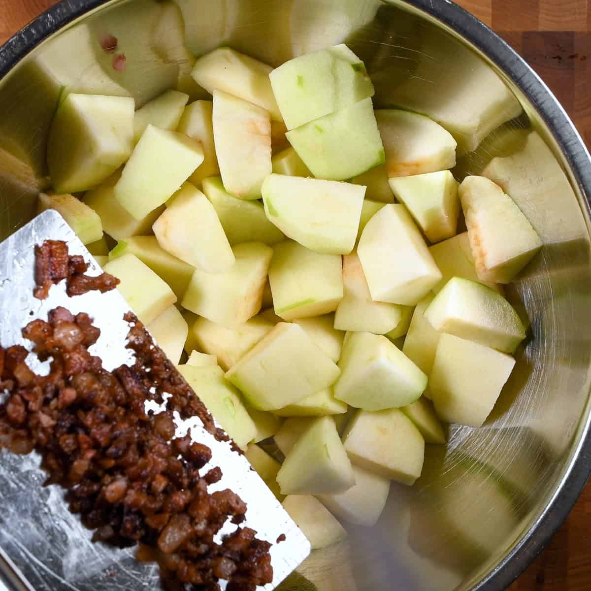 Add guanciale to the apples.