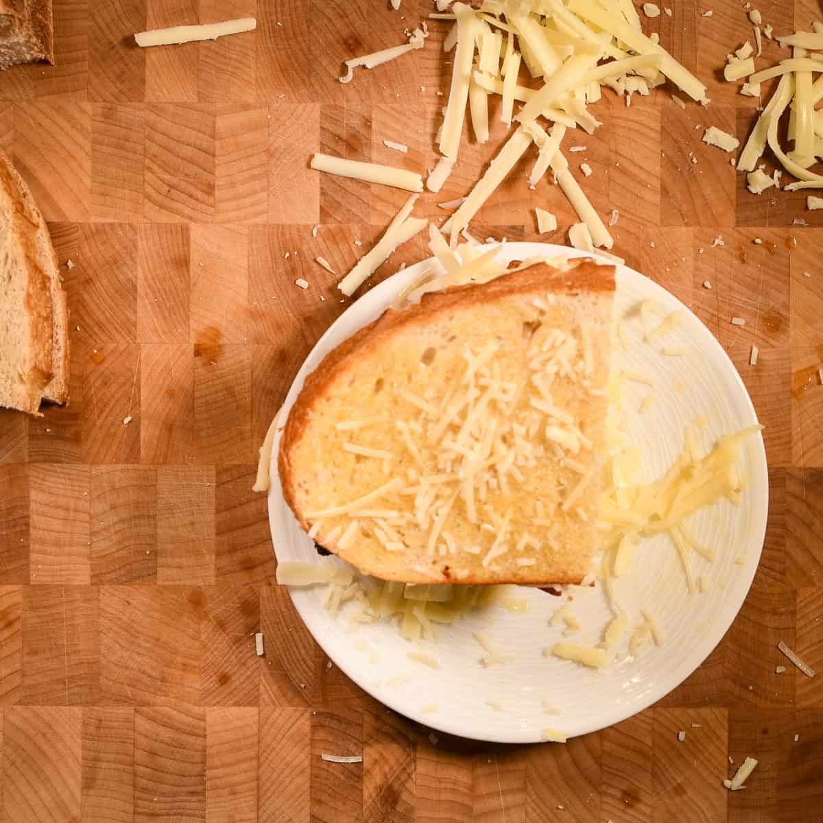 Add the top piece of sourdough bread and more cheese.