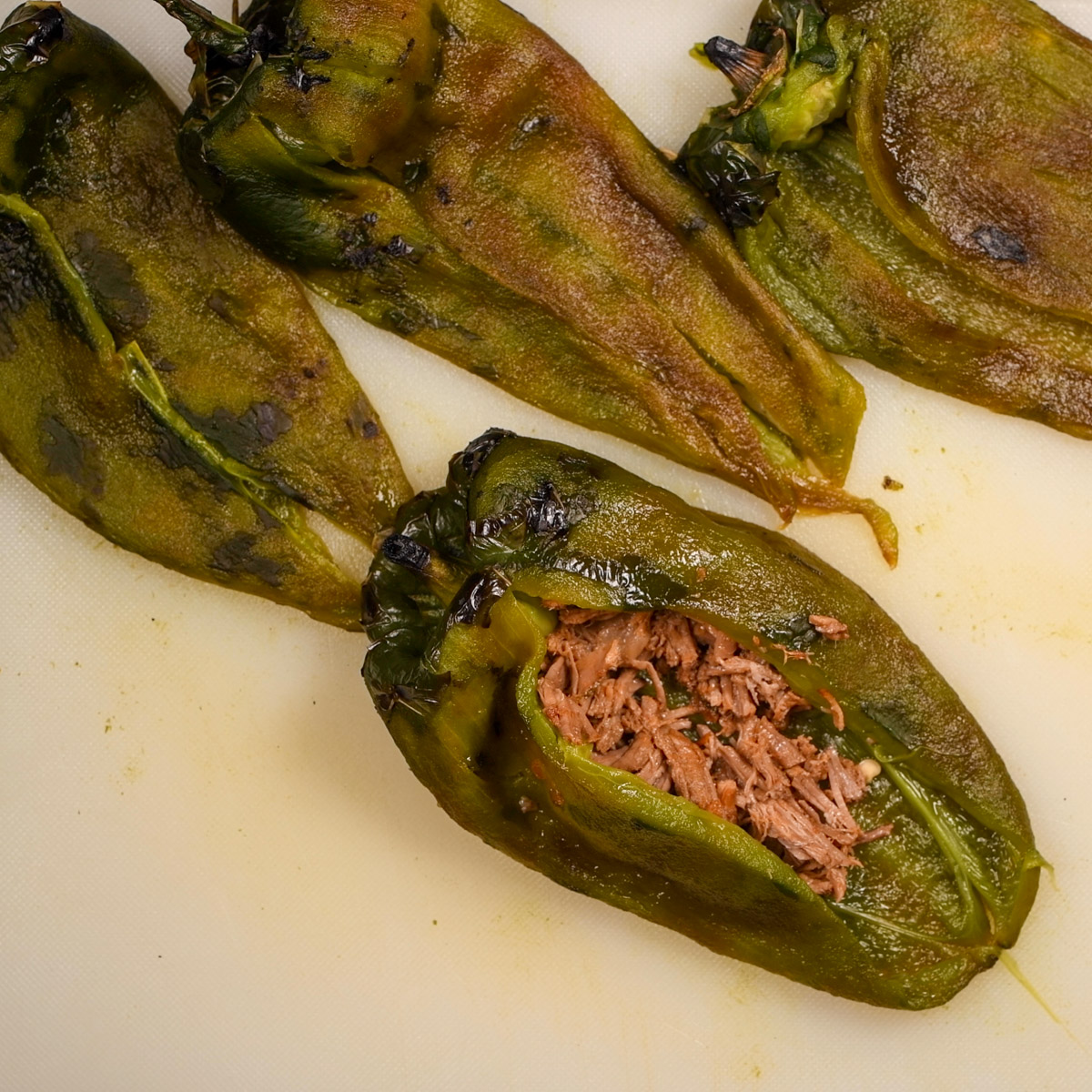Stuff each poblano pepper with brisket.