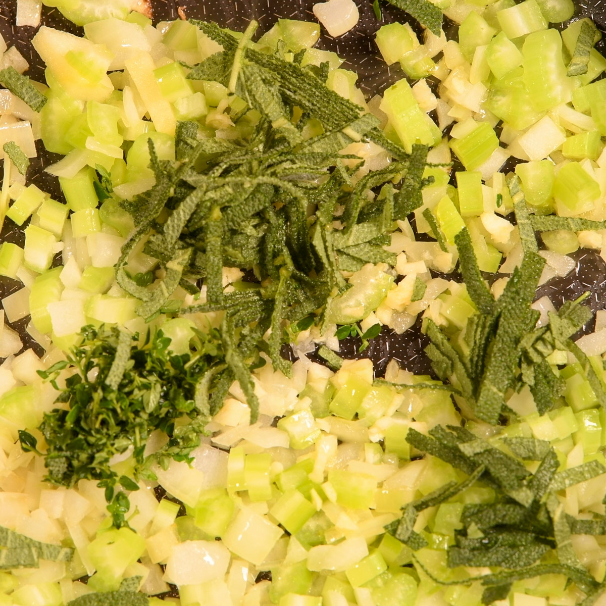 Add herbs to the vegetables.