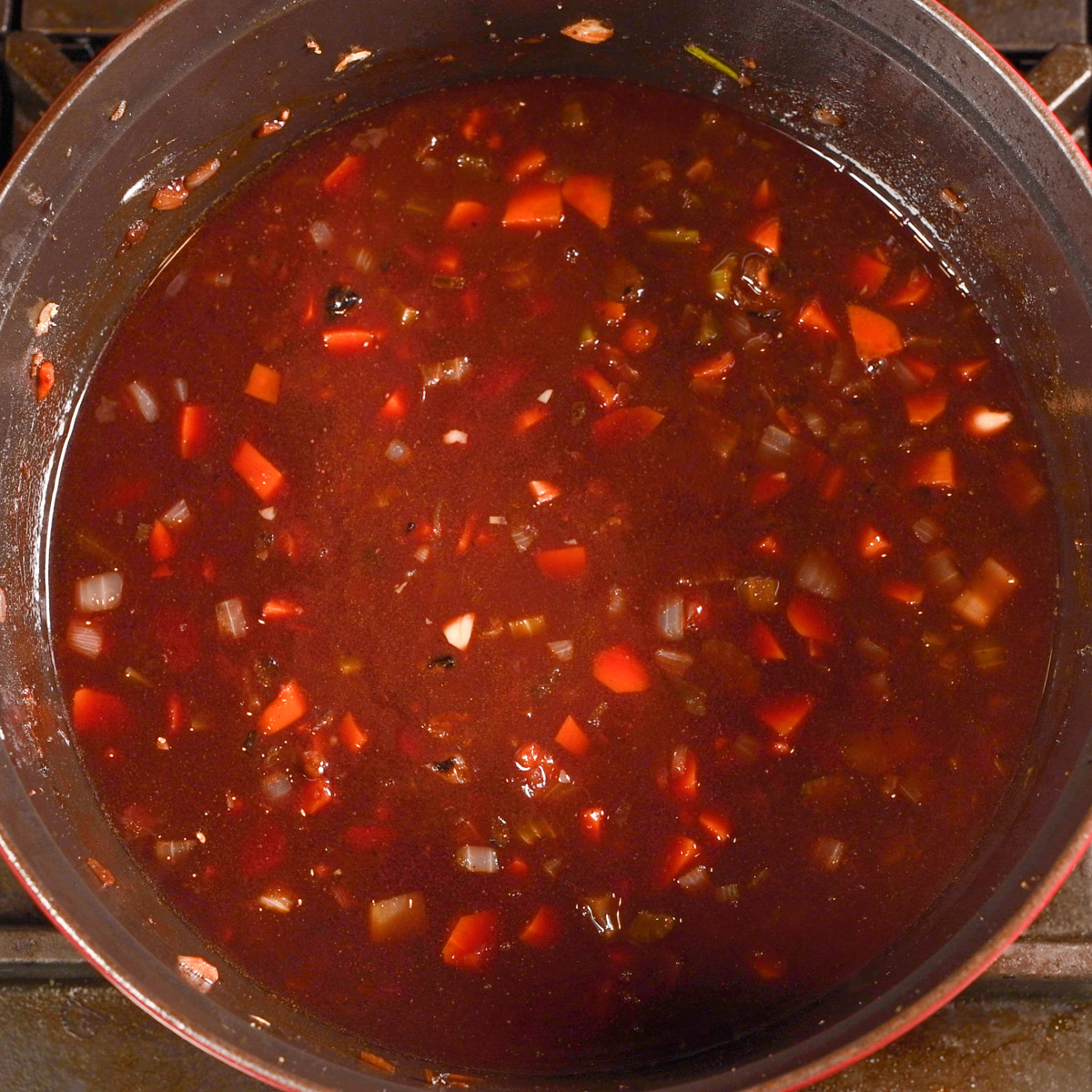 Stir to combine the wine, tomato paste and vegetables.