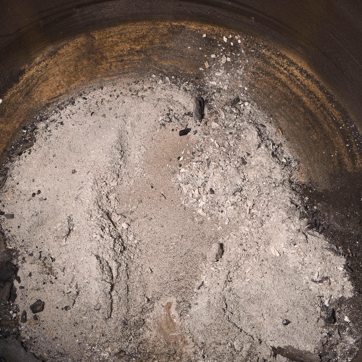 Ash can accumulate under the Kamado Joe ash drawer assembly.