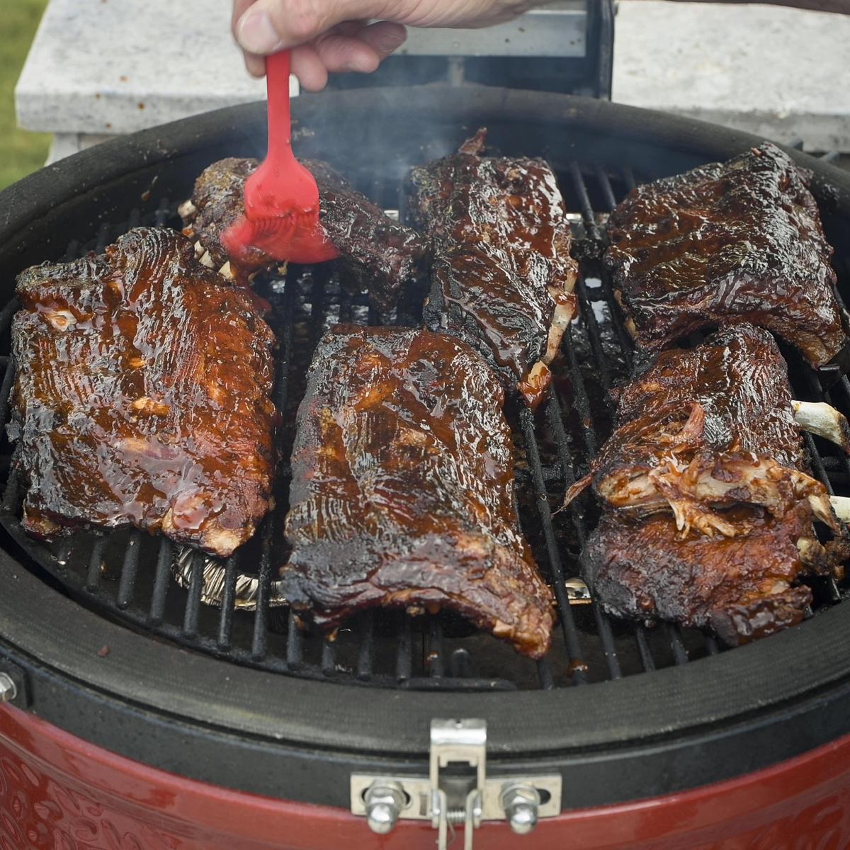 Baby back ribs over a water pan.