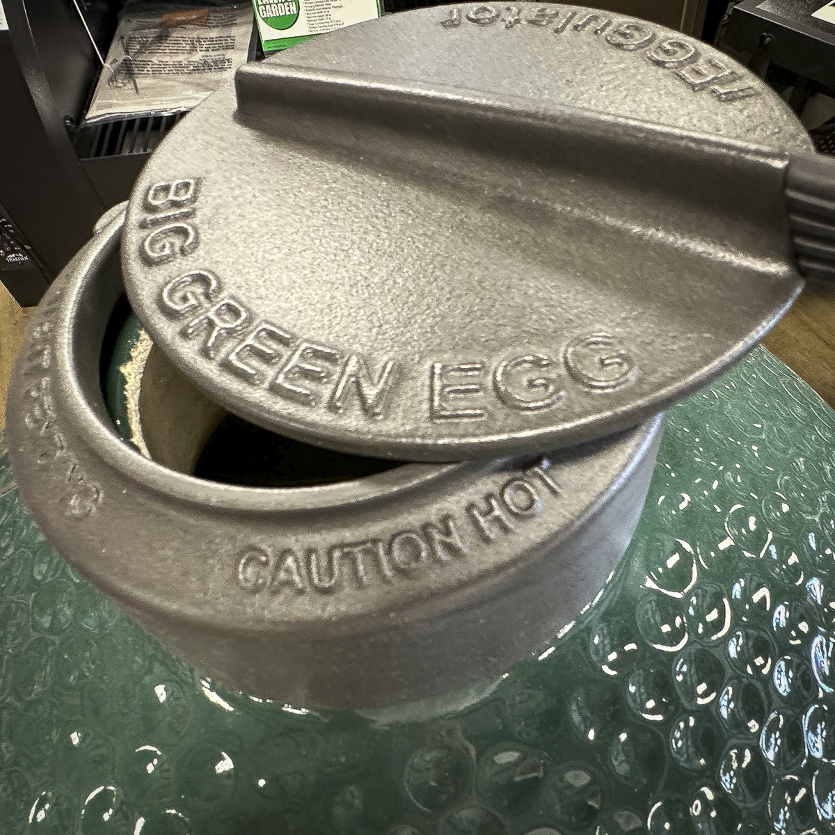 The top vent on the Big Green Egg is made of cast iron.