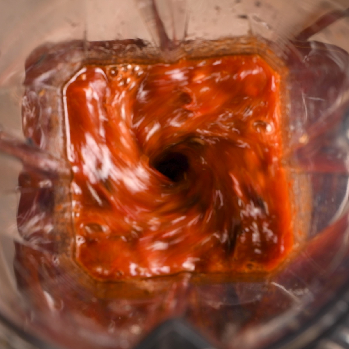 Blend the roasted chiles with spices.