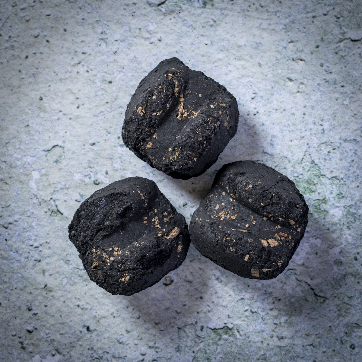 Briquettes contain fillers and produce more ash than lump charcoal.