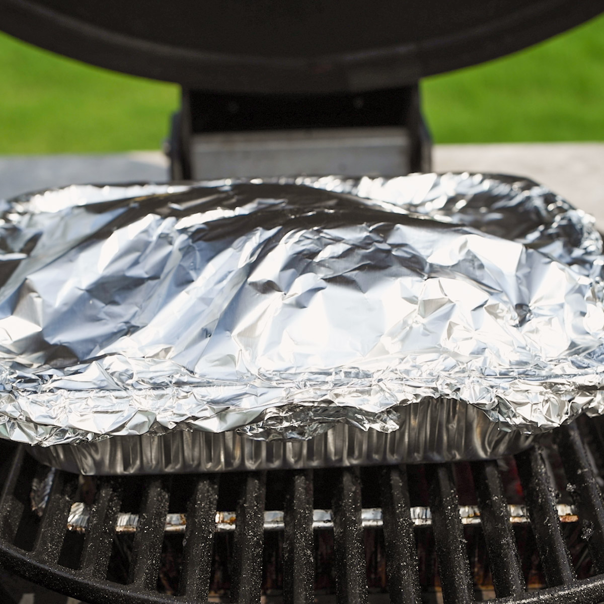 After done smoking, cover the brisket with foil and return to the smoker.