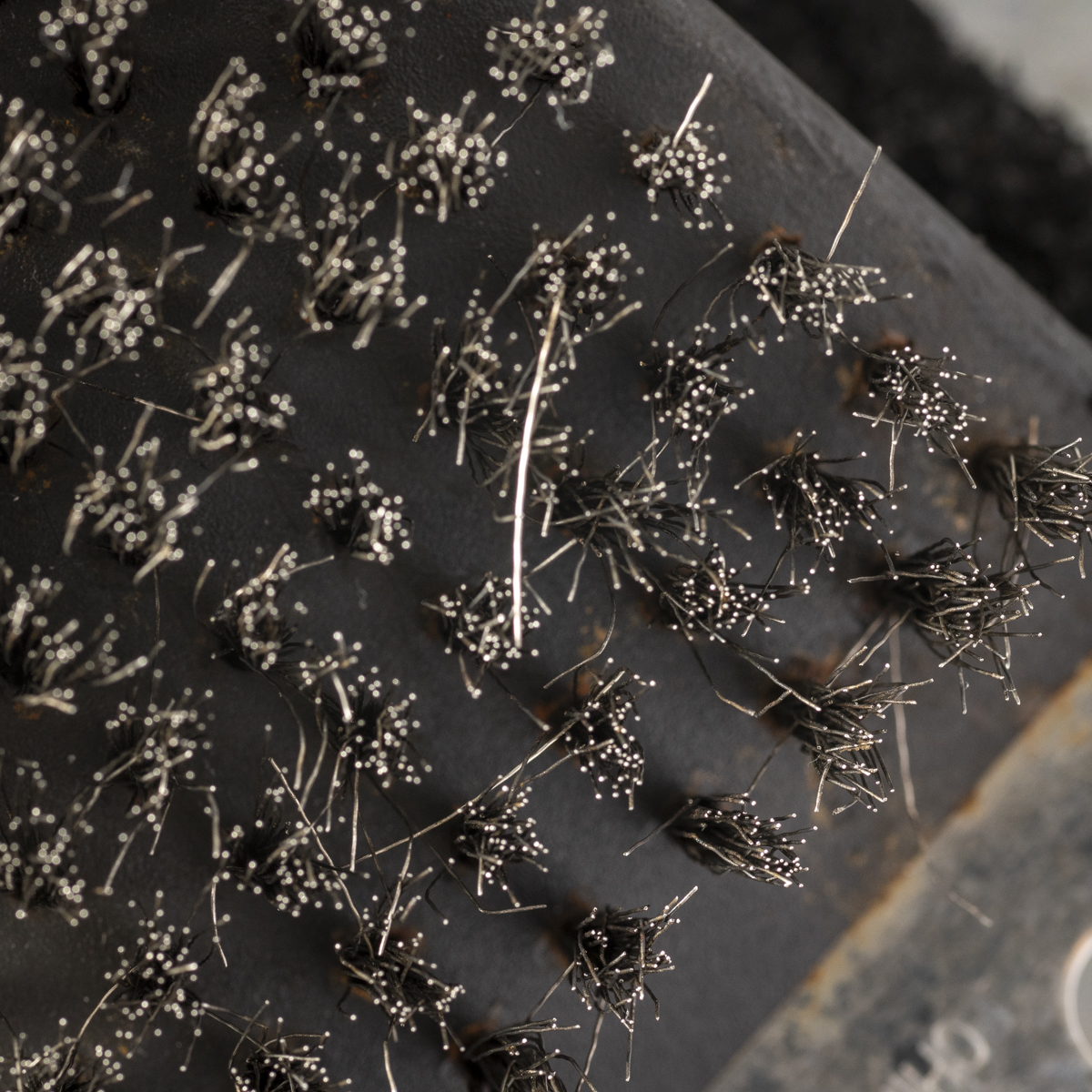 A wire bristle brush can shed bristles.