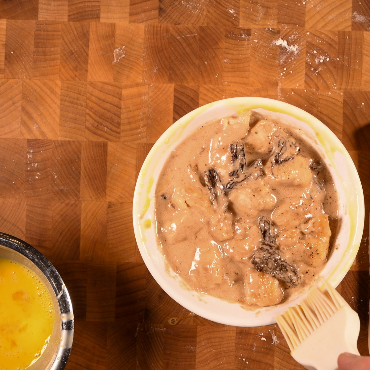 Brush rim of casserole dish with egg wash.