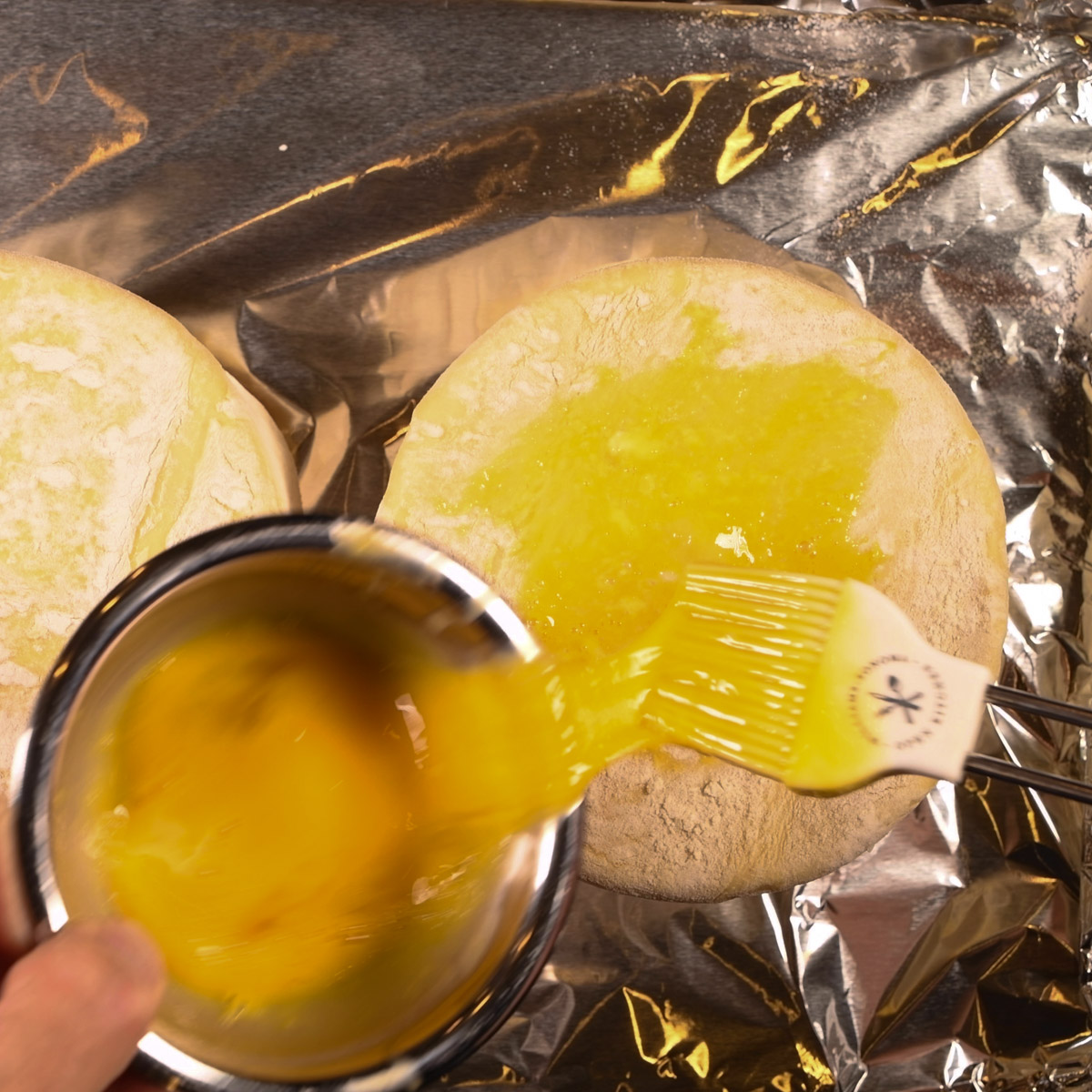 Brush top of puff pastry with egg wash.