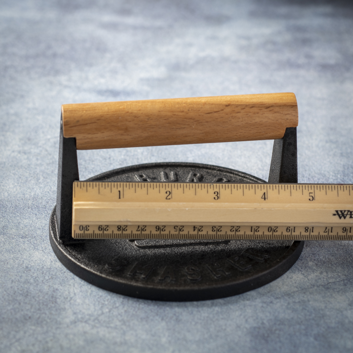 The Burger Smasher cast iron press has 4.25-inches of handle clearance.