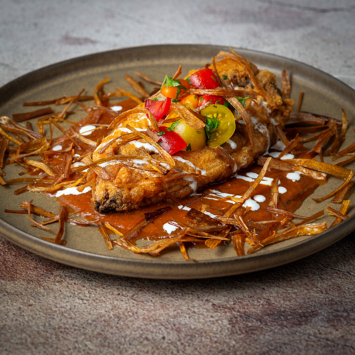 Brisket stuffed chile relleno.