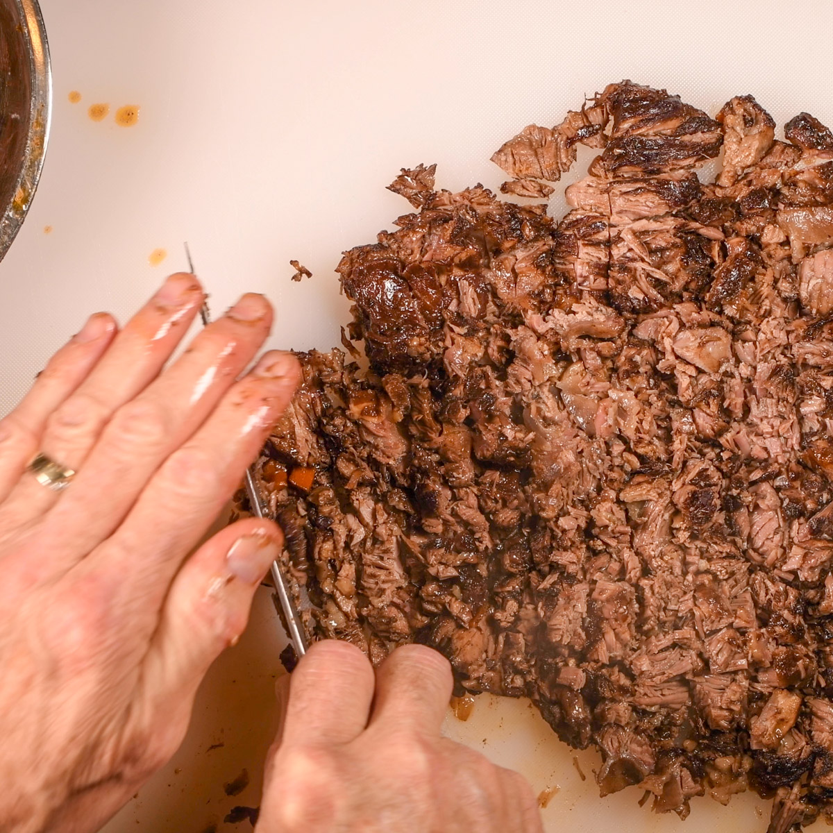 Chop the short rib meat and add it back to the Dutch oven.