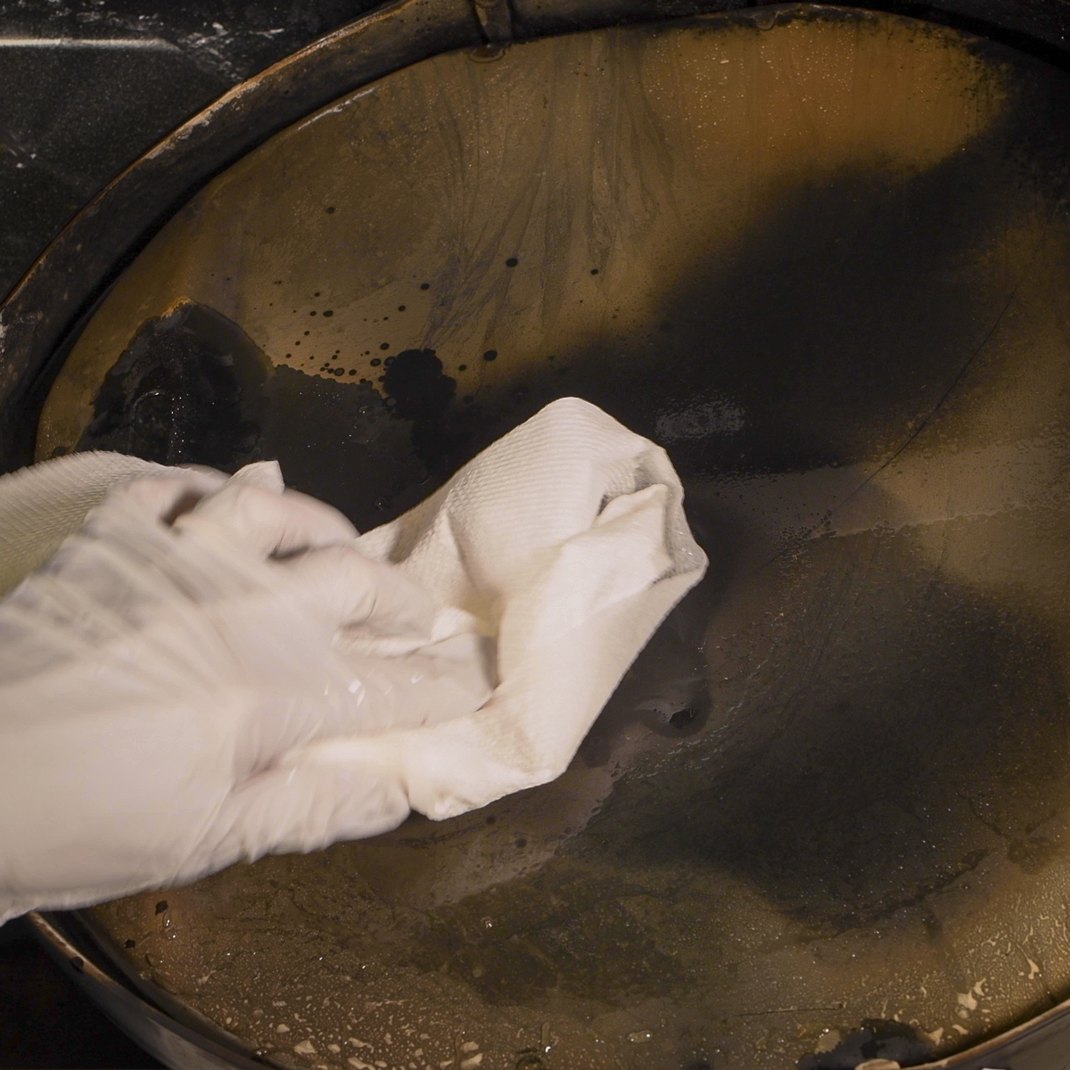 Wash the back of the griddle with soap and hot water.