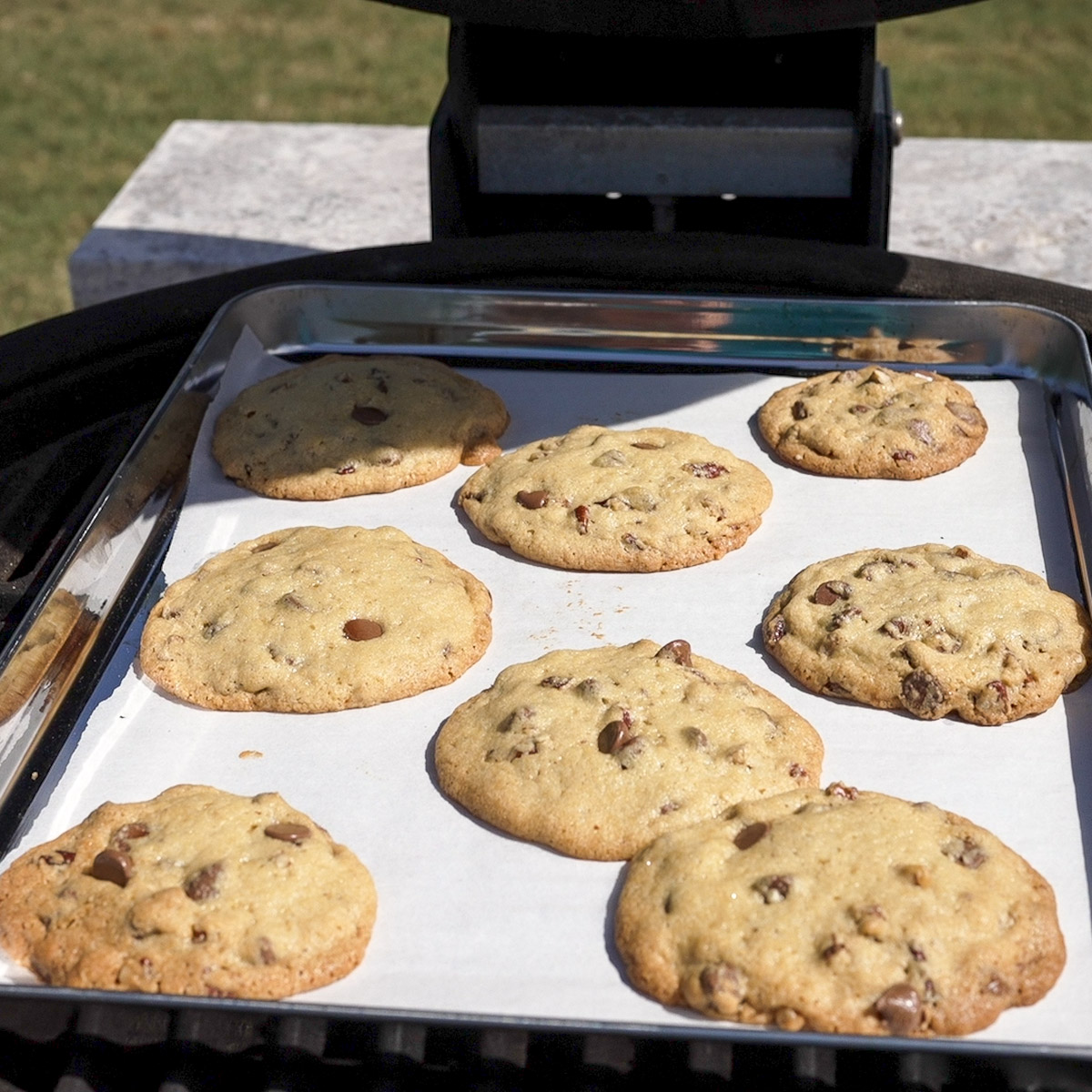 Chocolate chip cookies baking in a Kamado Joe.