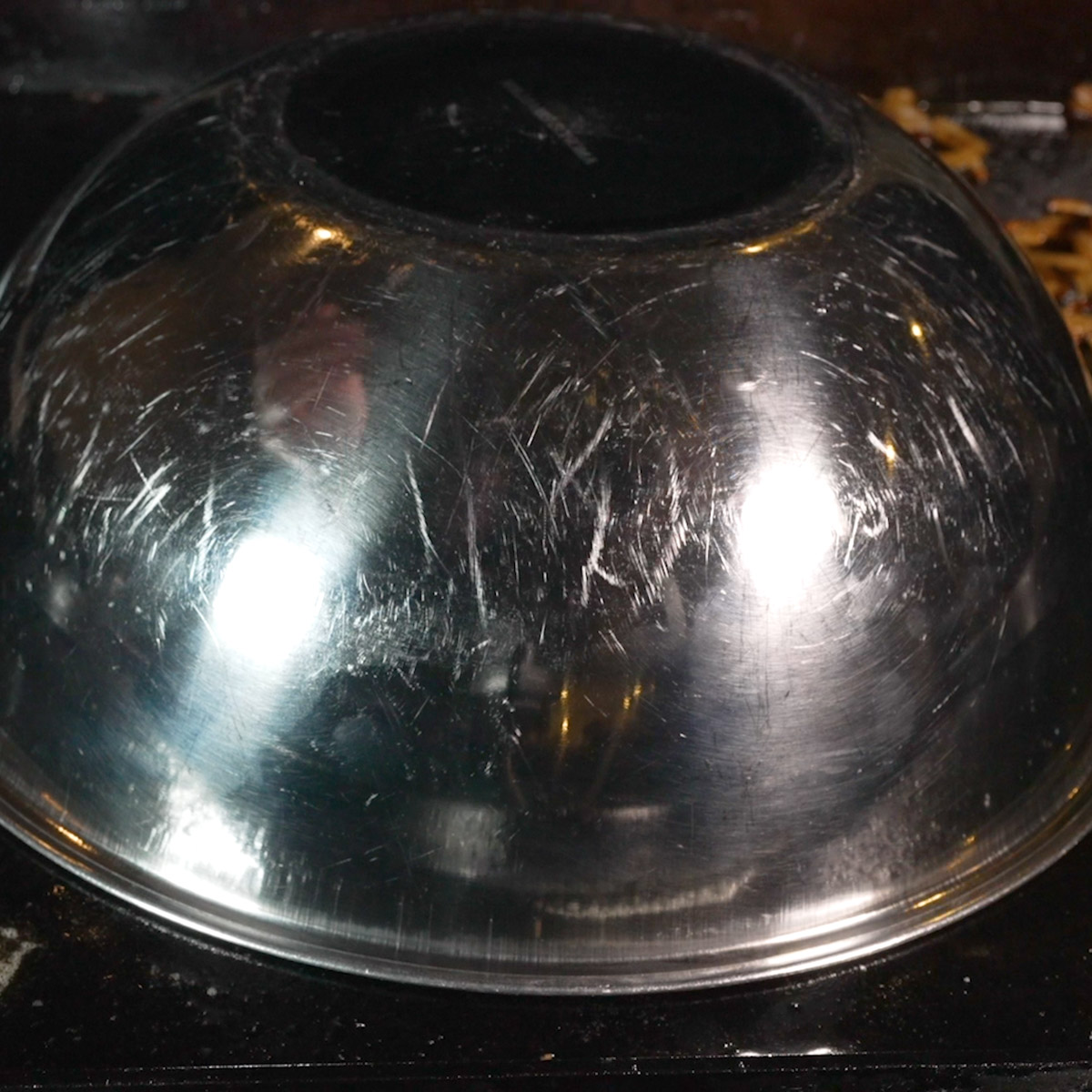 Cover the patty melt with a large bowl.