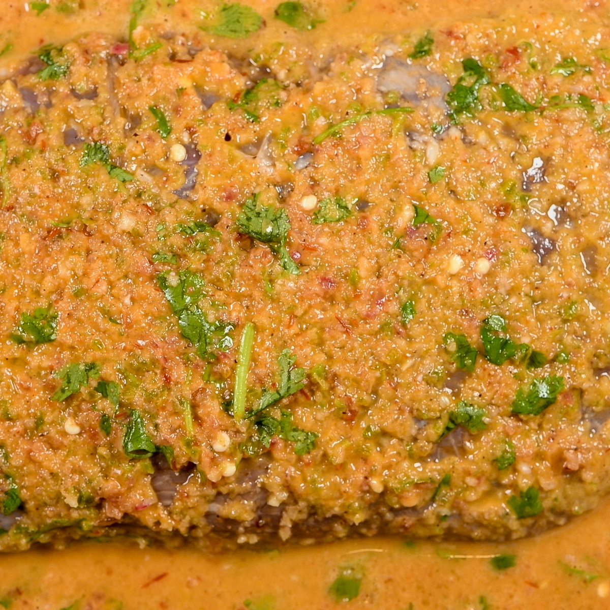 Pour the marinade over the flank steak.