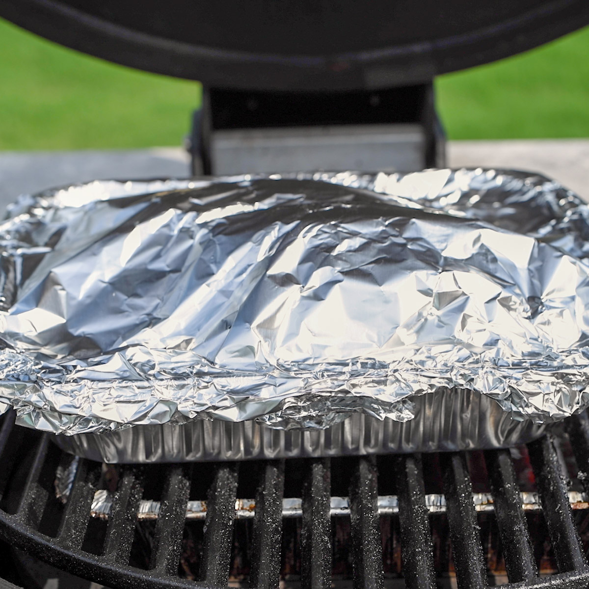 Ribs braising using the Texas crutch method.