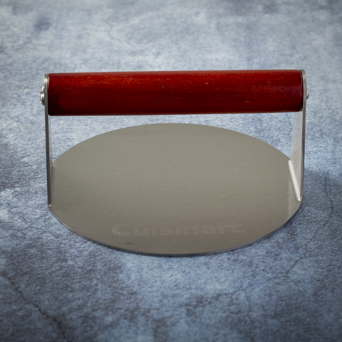 The Cuisinart stainless steel burger press has a wood handle.