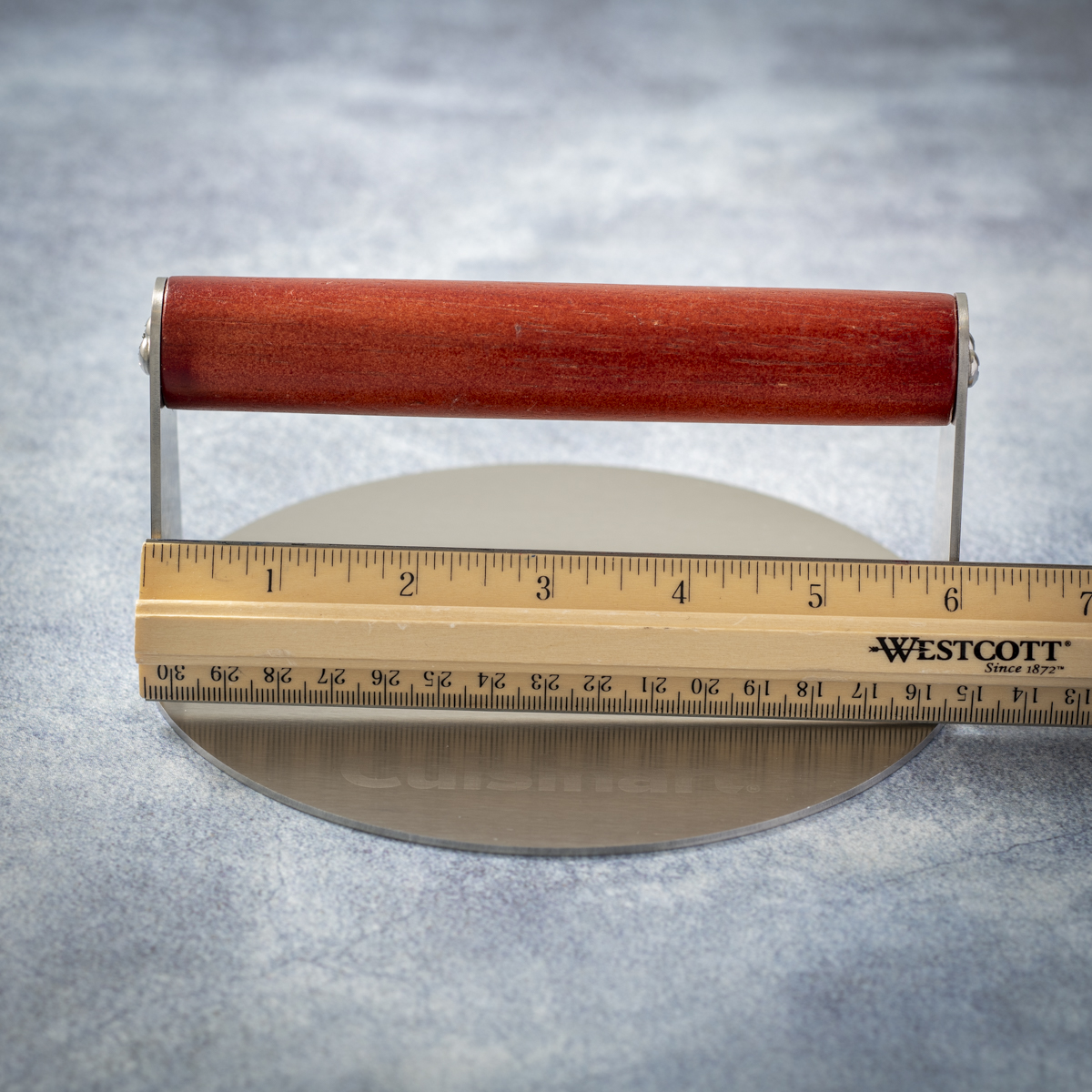 The Cuisinart stainless steel burger press has 6 inches of handle clearance.