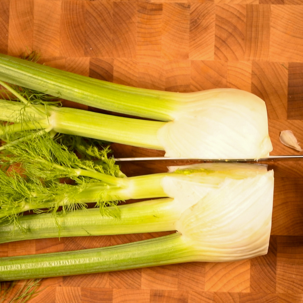 Cut fennel bulb in half.