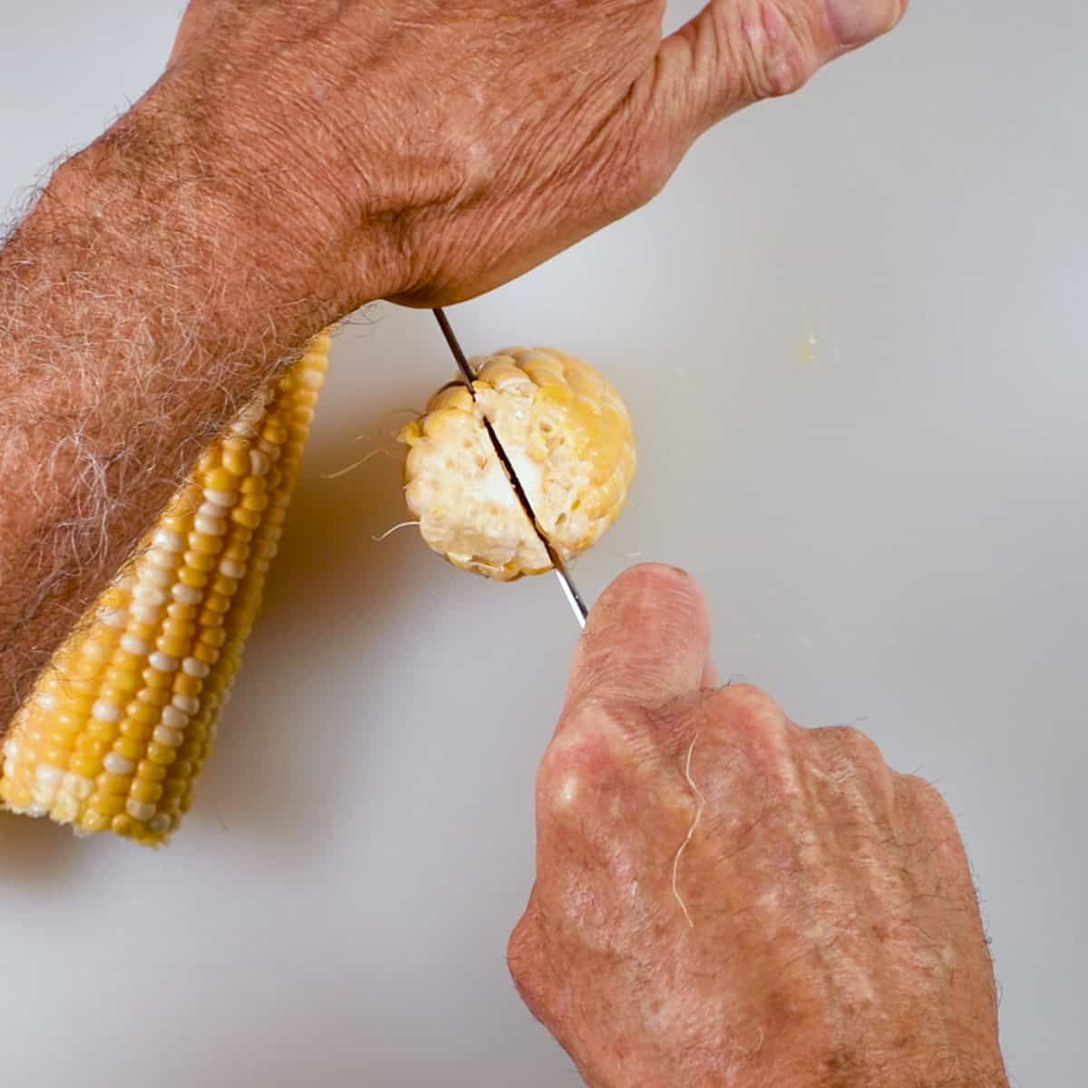Cut the corn down the middle.