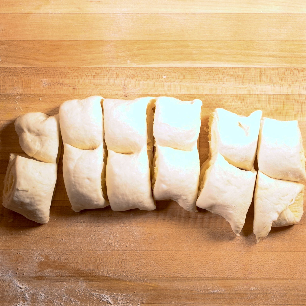 Cut the rolled up dough into 12 pieces.