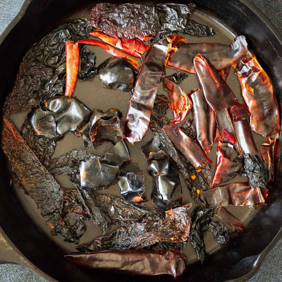 Roast dried chiles in a cast iron skillet.