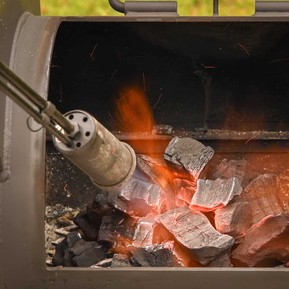 Lighting an offset stick burner.