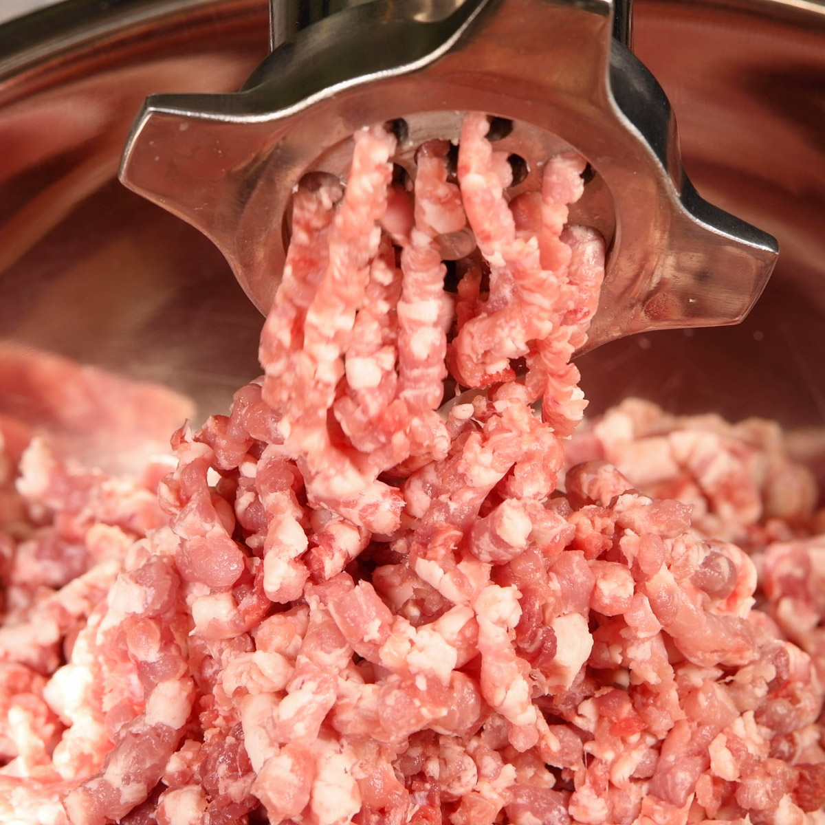 Grind the pork shoulder using a course grind.