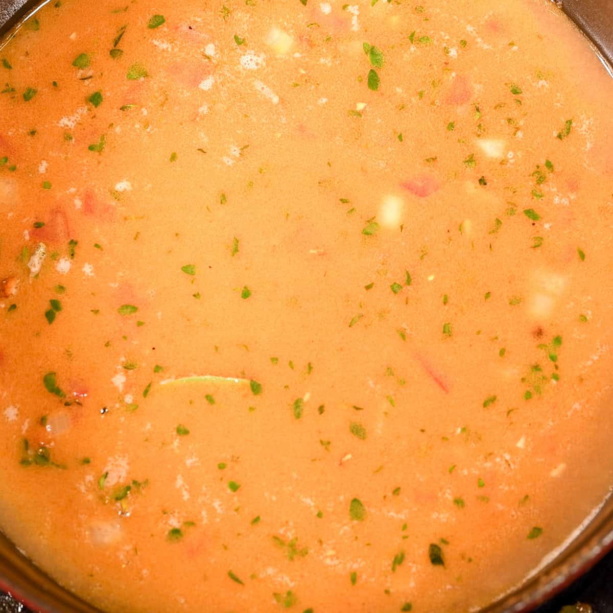 Add the shrimp stock and simmer.