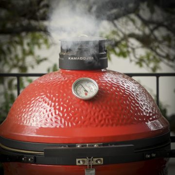 Kamado Joe with white smoke.