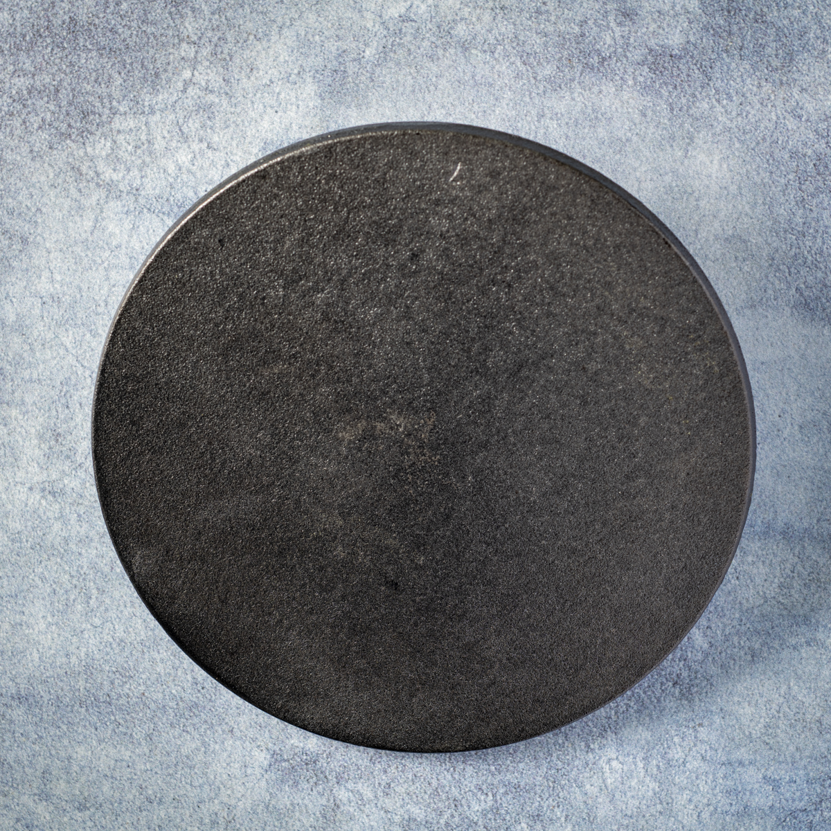 Lodge 8-inch cast-iron burger press.