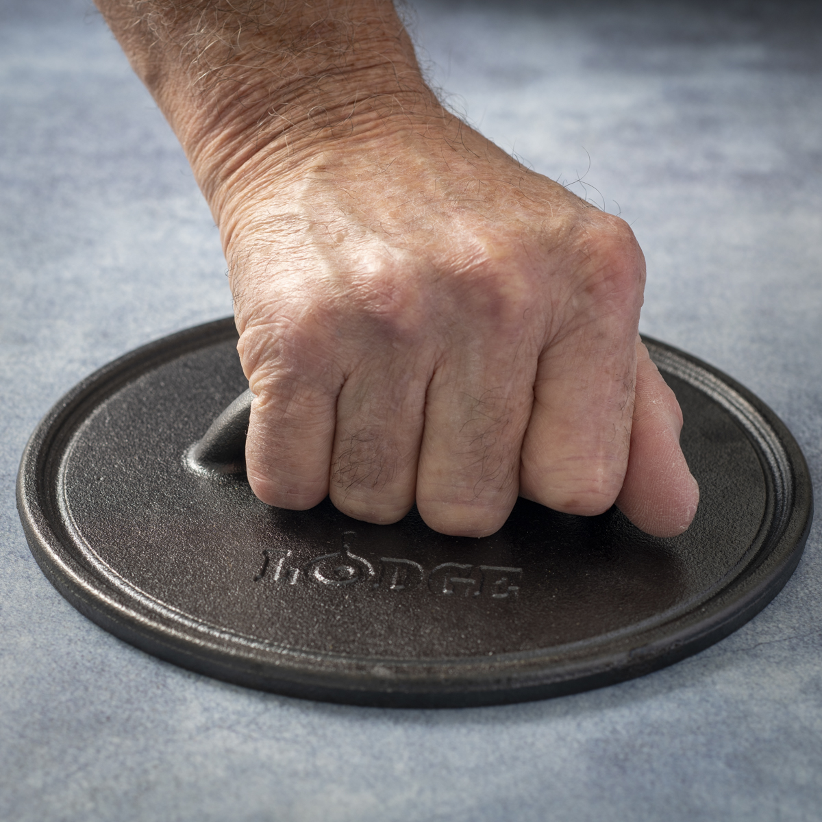 Lodge 8-inch cast-iron burger press has virtually no knuckle clearance.