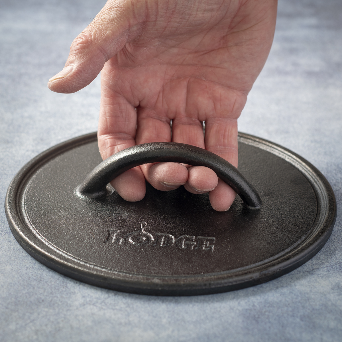 The handle on the Lodge 8-inch cast-iron burger press is very small.