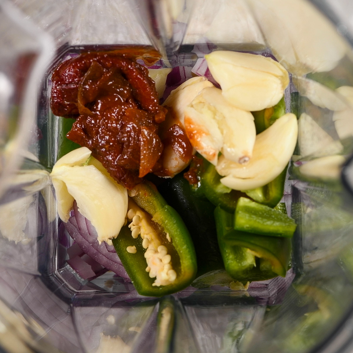 Add all of the marinade ingredients to a blender.