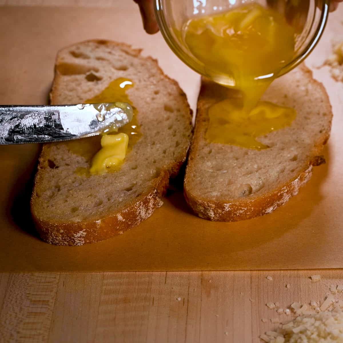Butter both sides of the bread.
