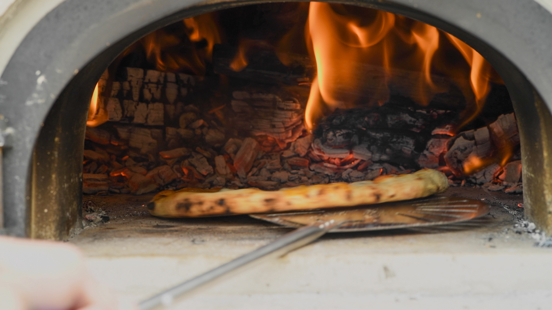 Rotating a Pizza Using the 9" Turning Pizza Peel.