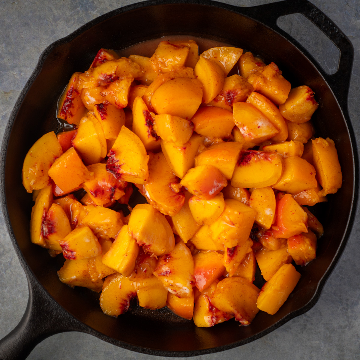 Peaches in cast iron skillet.