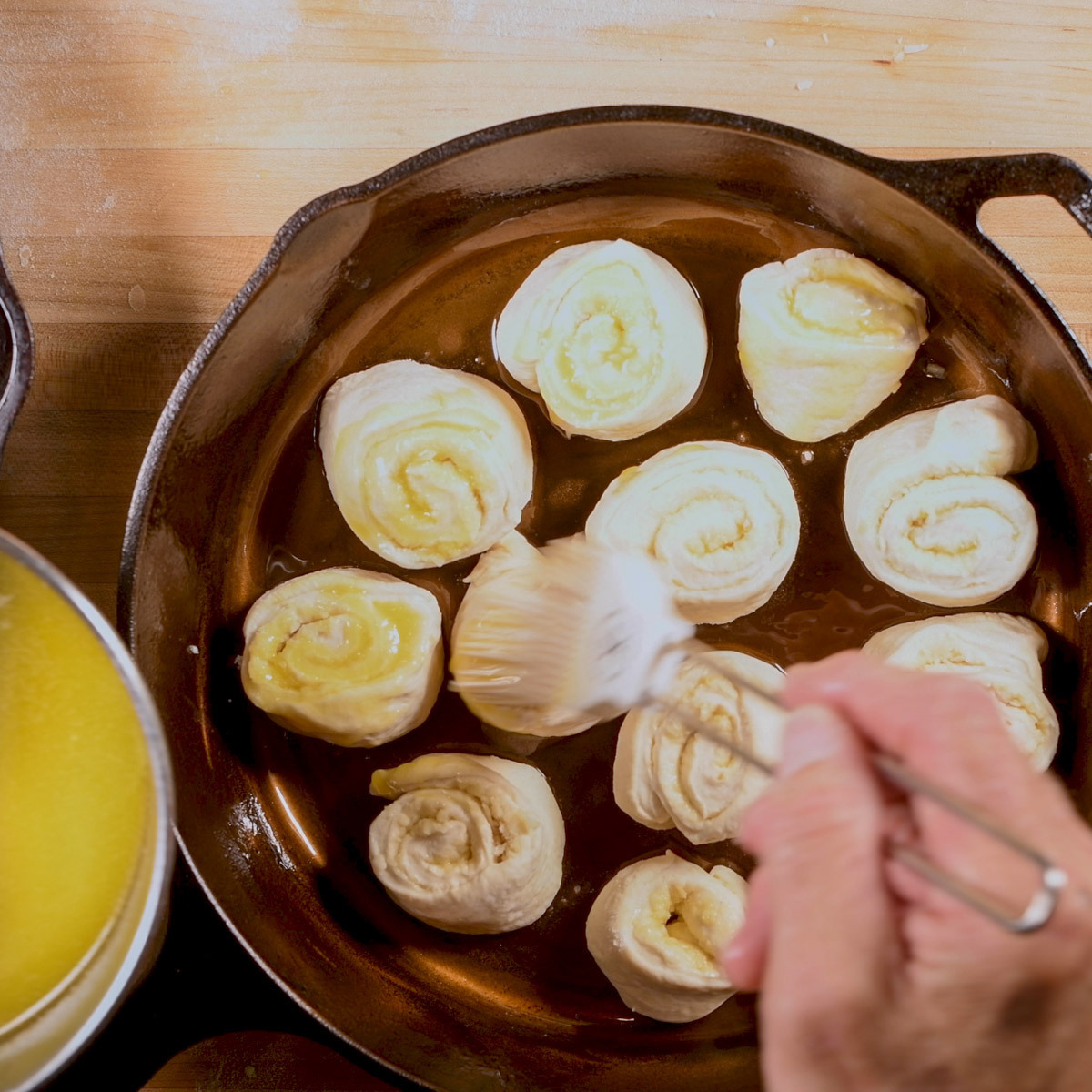 Place the dough pieces in a cast iron skillet.